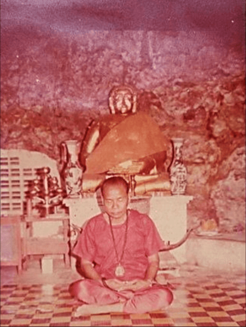 Ajarn Chum Chai Kiree meditating inside the sacred cave at Khao Or