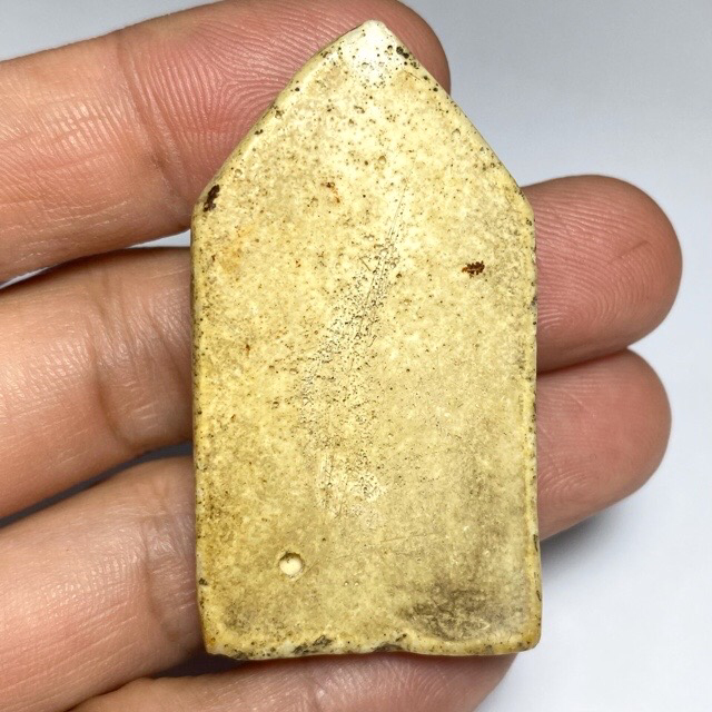 in hand rear face of amulet khun phaen nang kumarn luang por guay hlang riab
